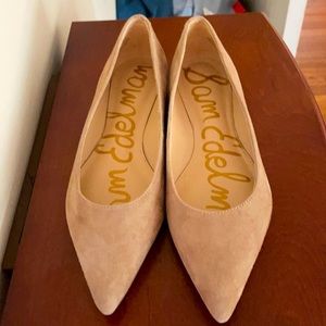 Lightly worn suede flats.